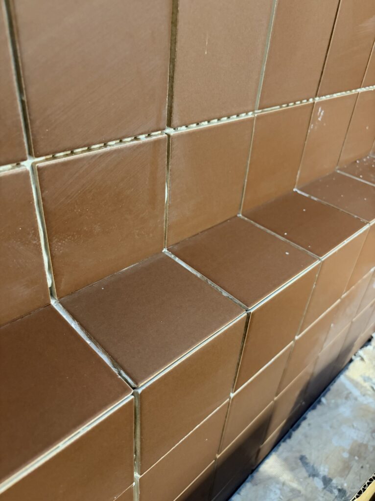 mitered corners in the tile creates a cleaner look